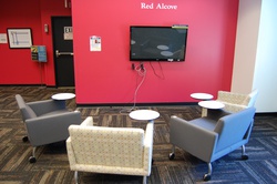 Red Alcove screen and cushioned chairs